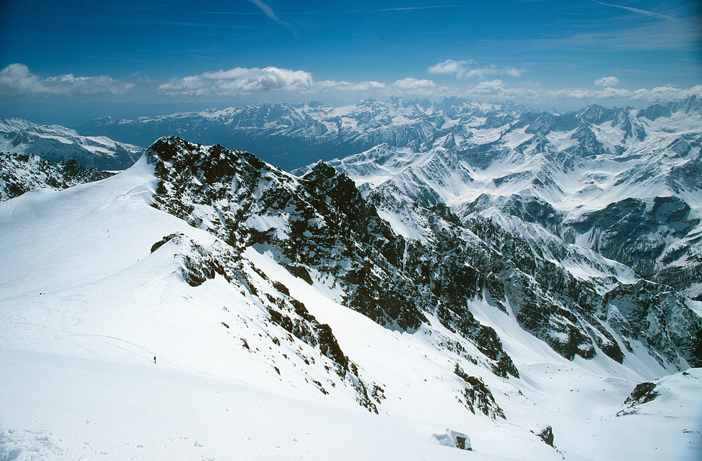 South-eastern view from the summit of Punta San Matteo (3676m), the highest peak of the close rocky ridge is M. Giumella (3594m).