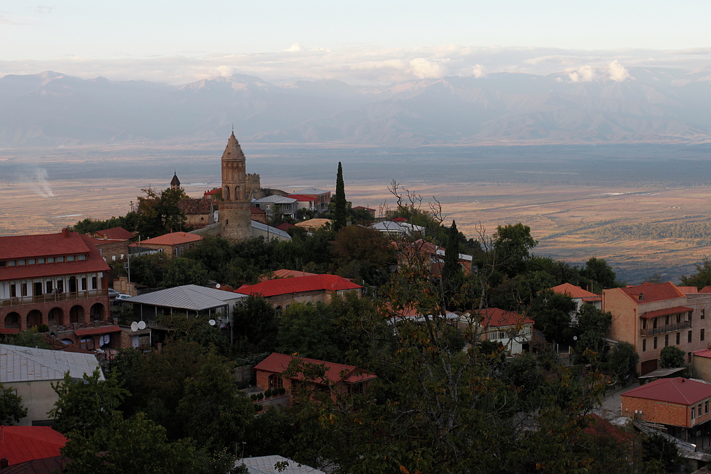 Charming Signagi - high above vineyards, Caucasus range in the background.