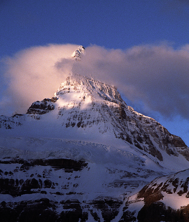 Mount Assiniboine (3618m), canadian Matterhorn, more than 1500m above the frozen Lake Magog.