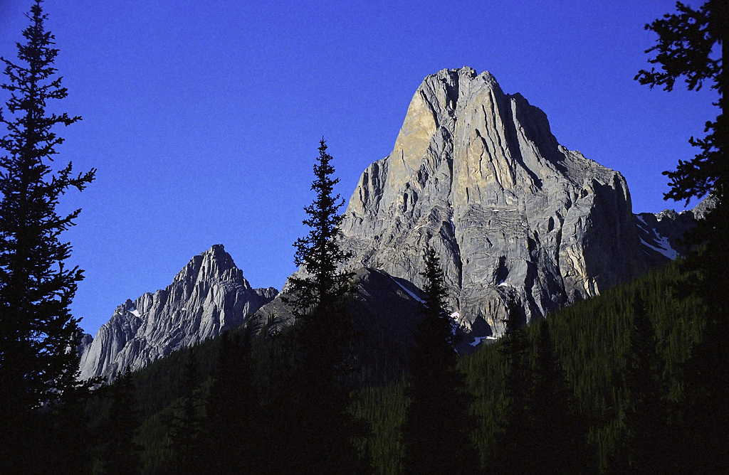 Limestone monolith Mount Louis (2682m) in the Sawback Range magically attracts mountaineers and lightnings.
