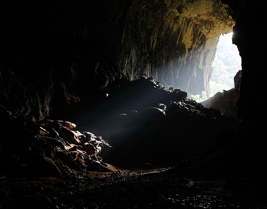 Shy rays of light entering the huge Deer Cave, Gunung Mulu National Park